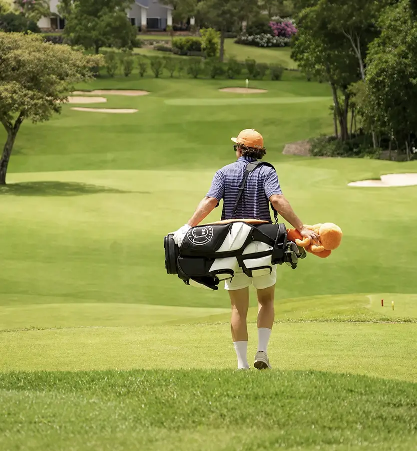 Golfer walking the championship course at Lucero