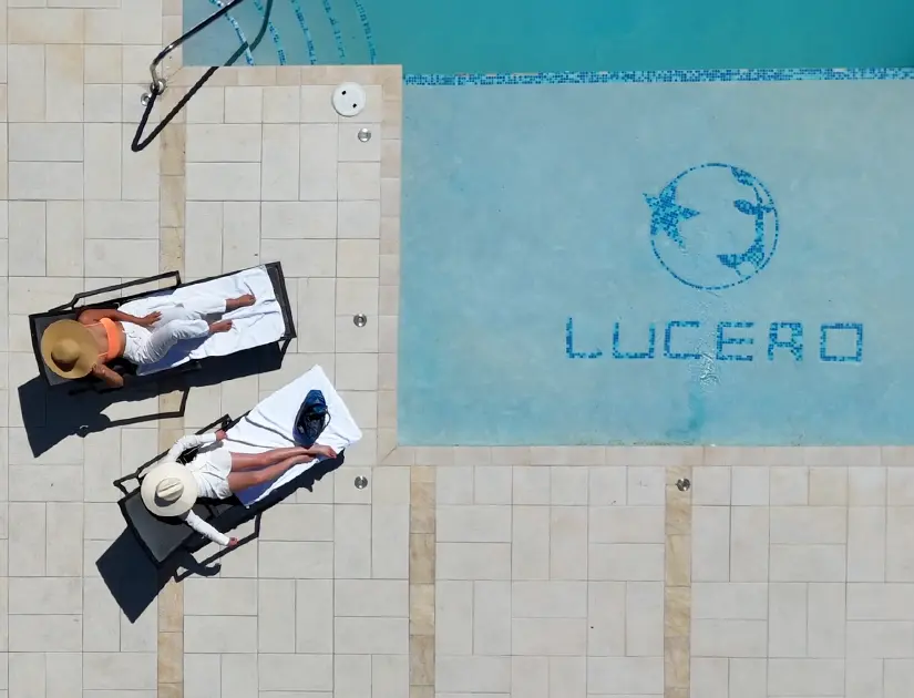 Aerial view of the Lucero pool with guests relaxing on loungers
